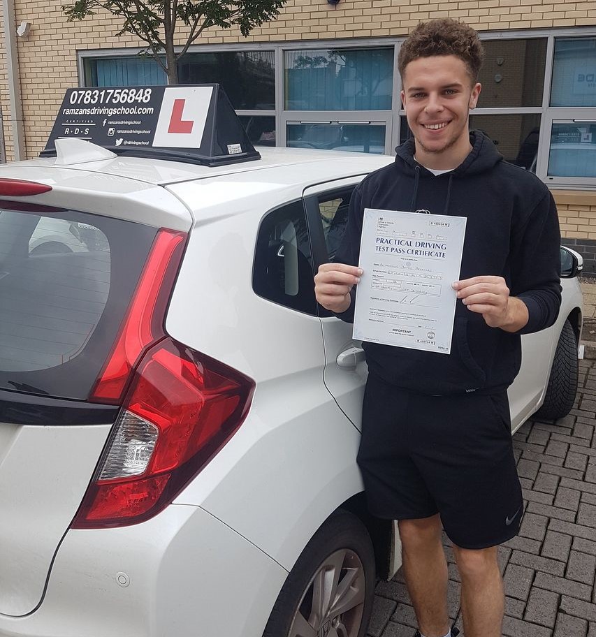 Image of a learner driver showing their test certificate